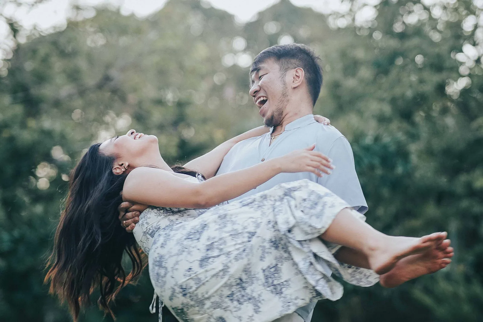 Groom lifting his bride in laughter, Silang Cavite — candid moment by Vivid Visuals
